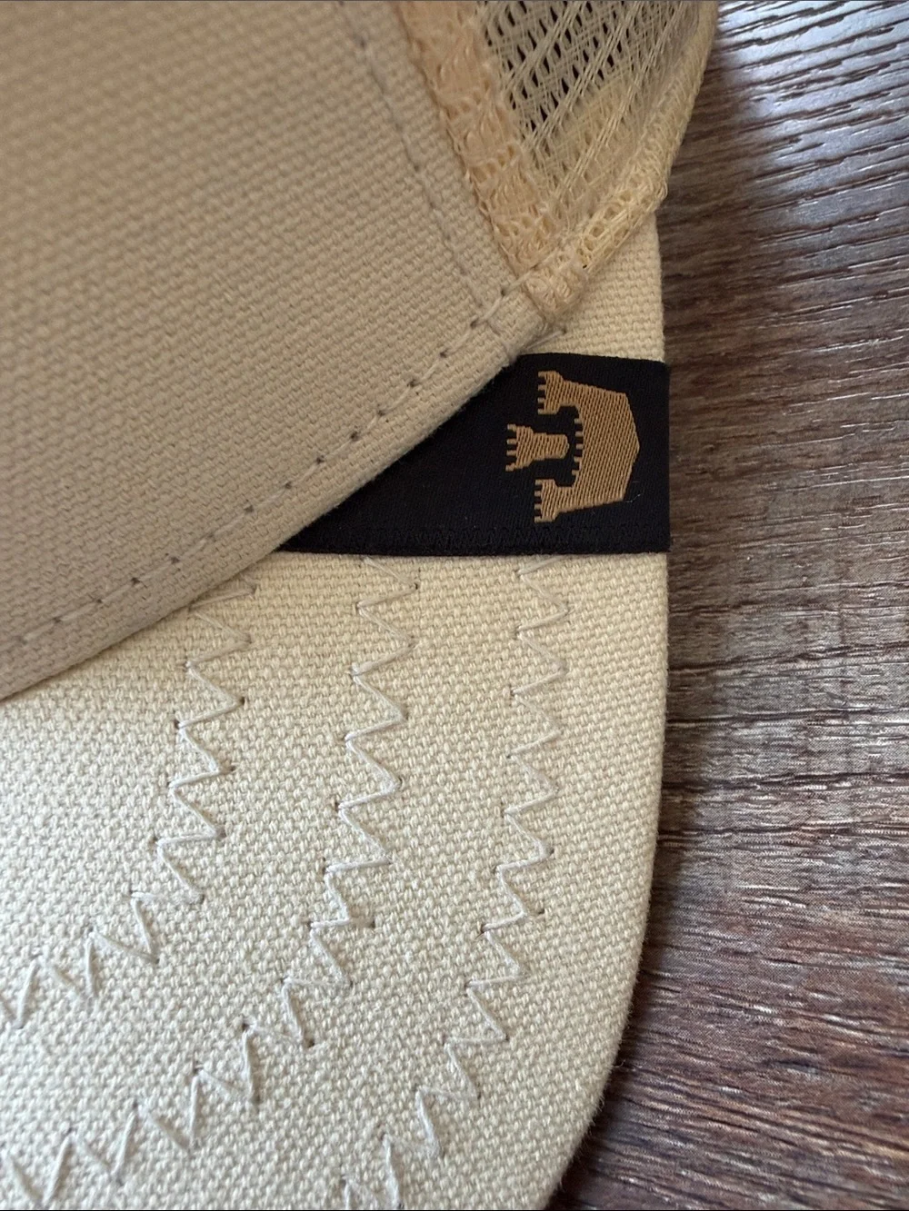 Goorin Bros Cream Trucker Hat with Brown Snake Patch